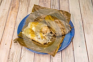 Tamale stuffed with chicken meat wrapped in banana leaves