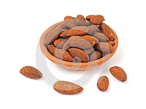 Tamari flavored almonds in a terracotta dish