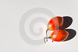 Tamarillho fruit with white background.