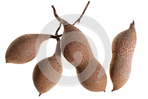 Tamarind fruit closeup on white background