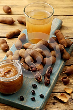 tamarind fruit and drink on rustic table