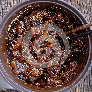 Tamarind paste cook with sugar and sesame to make delicious snacks food