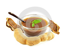 Tamarind water juice paste or soup in bowl with mint