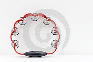 tambourine on the background of a white wall