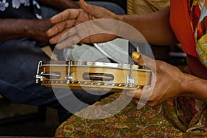 Tambourine being played by a ritimist during a samba performance