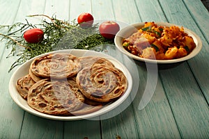 Tamilnadu food recipes- wheat paratha  served with curry