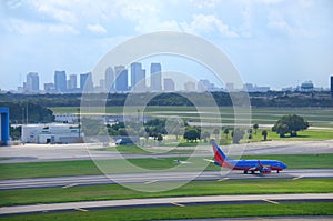 Tampa skyline with plane at Tampa Intl Airport