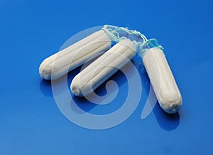 Tampons over blue photo