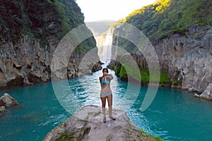 TAMUL, SAN LUIS POTOSI MEXICO - January 6, 2020:young woman taking her phone to take selfies photos in River and amazing