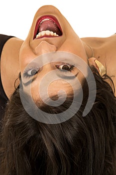 Tan female model upside down portrait mouth open