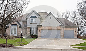 Tan and Gray Home with Triple Garage