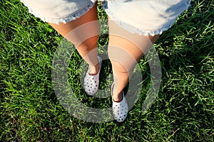 Tan leg white shoes green grass