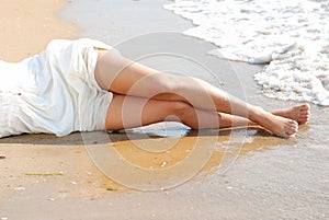 Tan legs on a beach