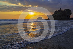 Tanah Lot in golden sunset, Bali, Indonesia