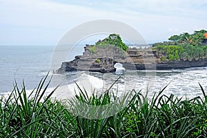 Tanah Lot regularly features on Bali postcards and travel brochures, thanks to its stunning and unique offshore setting
