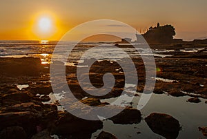 Tanah Lot water temple in Bali. Indonesia nature landscape. Sunset