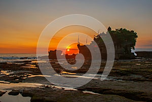 Tanah Lot water temple in Bali. Indonesia nature landscape. Sunset