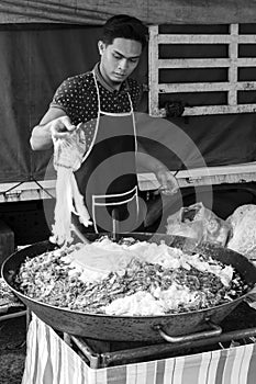 Tanah Rata, Malaysia, December 17 2017: Chef cooks fried noodles