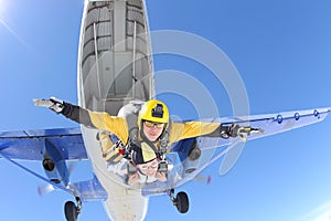 Tandem jump. Skydiving in the blue sky.