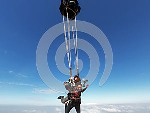 Tandem parachute jump. Beautiful Brazilian woman