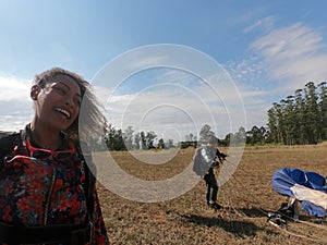 Tandem parachute jump. Beautiful Brazilian woman