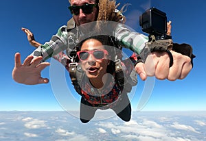 Tandem parachute jump. Beautiful Brazilian woman