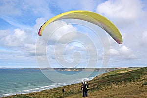 Tandem paraglider launching at Newgale, Wales