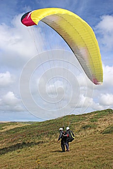 Tandem paraglider launching at Newgale, Wales