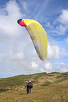 Tandem paraglider launching at Newgale, Wales