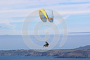 Tandem paraglider lflying at Newgale, Wales