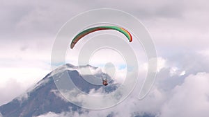 Tandem Paragliding Against Populated Area In Andes