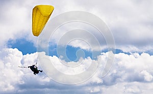 Tandem paragliding flight in clouds