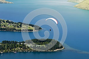 Tandem paragliding over Lake Wakatipu in Queenstown, New Zealand