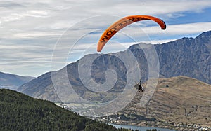 Tandem paragliding over Lake Wakatipu in Queenstown, New Zealand