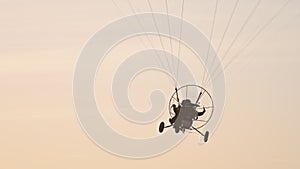 Tandem Paramotor Gliding - two men flying and gliding in the air