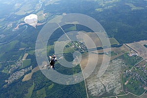 Tandem skydiving. Two guys are falling in the sky.