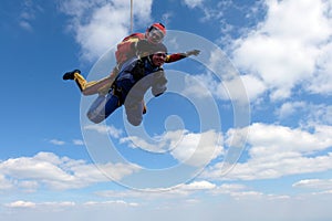 Tandem skydiving. Two strong men are in the sky.