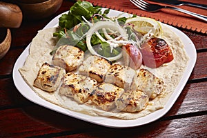 Tandoori Chicken Malai tikka boti with lemon, salad and bread served in dish isolated on table side view of middle east food