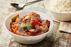 Tandoori chicken Masala korma karahi with boiled rice served in dish isolated on table top view of arabic food