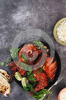 Tandoori chicken whole with peshwari naan, jeera rice and raita