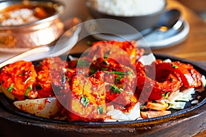 Tandoori Paneer Tikka. Cubes of cottage cheese, tomatoes, bell peppers and onion finished in clay oven photo