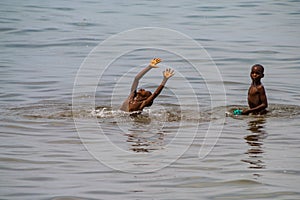 Tanganyika kids swimming in the lake