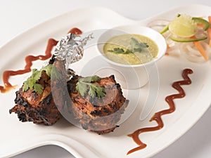 Tangdi kabab is an grilled chicken starter