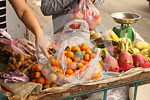 Tangerin dragon fruit rambutan mango fruit on market