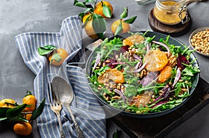 Tangerine and beet salad with arugula, walnuts and pine nuts