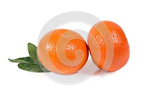 Tangerine, clementine with green leaves isolated clipping path