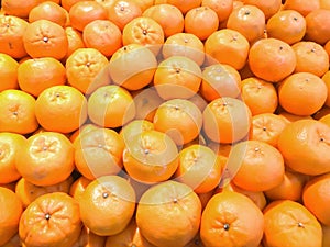 Tangerine deterioration almost rotten should not be eaten. Close-up of sliced oranges on a market. orange wallpaper. Orange backgr