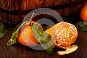 Tangerine or mandarin with leaves closeup