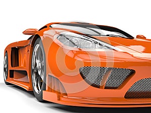 Tangerine orange modern super sports car - headlight extreme closeup shot