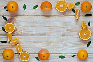 Tangerine slices decompose at the edges of the table